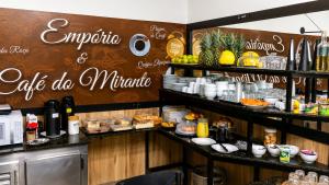 a kitchen with a counter with food on it at Hotel Mirante in Careaçu