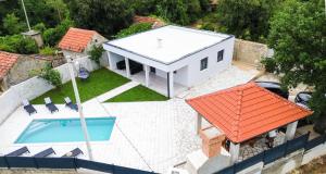 an aerial view of a house with a swimming pool at Villa Dub in Stolac +63 photos