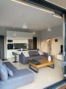a living room with a couch and a table at Villa Constangie in Marathon