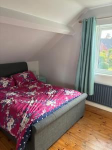 a bedroom with a bed and a window at Loughshore, Large Detached House, Jordanstown in Newtownabbey