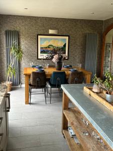 a dining room with a table and chairs at Loughshore, Large Detached House, Jordanstown in Newtownabbey