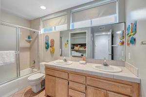 a bathroom with two sinks and a toilet at OCEAN FRONT - STUNNING VIEWS- VACATION PARADISE!! in Dana Point +21 photos