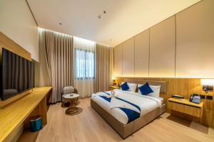 a hotel room with a bed and a television at فندق ايفر in Riyadh +58 photos