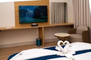 a hotel room with a bed and a tv at فندق ايفر in Riyadh