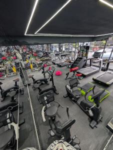 a gym filled with lots of exercise equipment at Townplace Hotel & Apartments in Port Harcourt