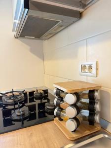 a kitchen with a stove and a pile of plates at ThePlaceToBe2 in Brăila