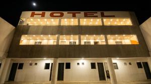 a hotel building with lights on top of it at Hotel Boneario in Vitória da Conquista