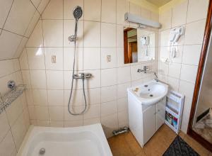 a bathroom with a shower and a sink at Noclegi u Marka in Czernichów +59 photos