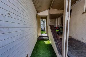 an empty side of a house with green grass at Bright 2 Bedroom, Private Garden in Herzliya