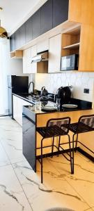 a kitchen with a table and two chairs in it at Golden in Cochabamba
