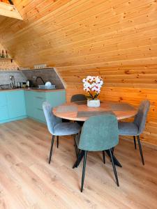 a dining room with a table and chairs at Ananta in Kobuleti