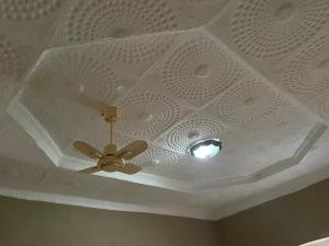 a ceiling with a ceiling fan in a room at Djilani Global Hub in Dirē Dawa