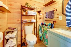 a bathroom with a toilet and a sink at Fire Pit, Gas Grill! Bright Cottage By Devils Lake in Manitou Beach +14 photos