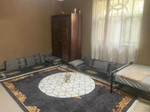 a living room with a couch and a table at Djilani Global Hub in Dirē Dawa