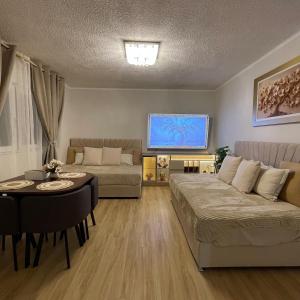 a living room with a couch and a table at Mini Apartment Ares 3 in Lima