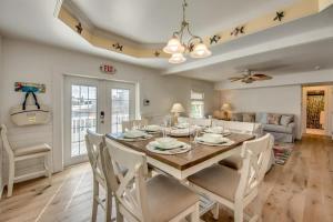 a dining room and living room with a table and chairs at 275 Ohio in Fort Myers Beach