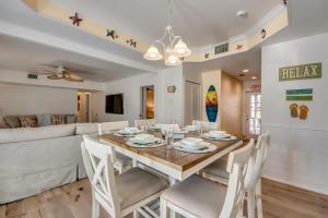 a dining room and living room with a table and chairs at 275 Ohio in Fort Myers Beach +60 photos