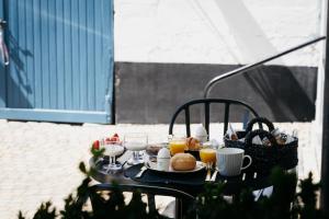 a table with a tray of food and drinks at Onder de Linde B&B in Valkenburg