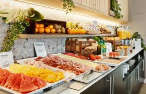 a buffet with fruits and other foods on display at Sercotel AB Rivas in Rivas-Vaciamadrid