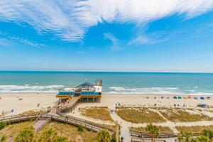 a beach with a lighthouse and the ocean at Yachtsman S406 2 BR in Myrtle Beach