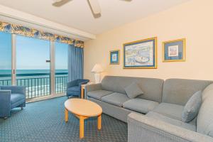 a living room with a couch and a table at Yachtsman S406 2 BR in Myrtle Beach