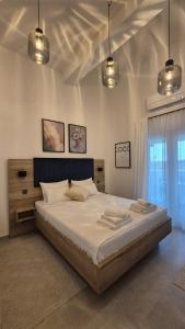 a bedroom with a large bed with two towels on it at Rimac Apartments in Novalja +47 photos