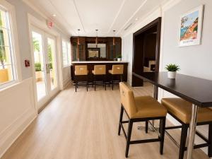 a kitchen and dining room with a table and chairs at Monaco Bay Club 13 in Fort Lauderdale