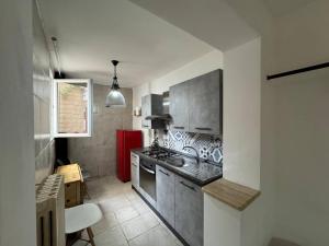 a kitchen with a sink and a stove at Apartment Simone in Lecce