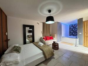 a bedroom with a bed and a couch in it at Apartment Simone in Lecce