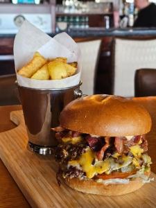 a sandwich and a cup of french fries on a tray at The Beach Hotel in Mullaghmore