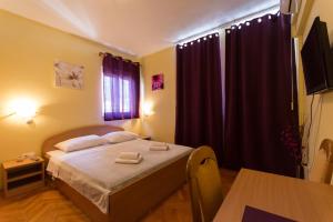 Postel nebo postele na pokoji v ubytování Guest House Mamut
