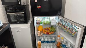a refrigerator filled with lots of food and drinks at Carlo FiVe in Porto Empedocle +23 photos