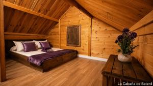 a bedroom with a bed in a wooden cabin at Villa Soñada Setenil in Setenil +21 photos