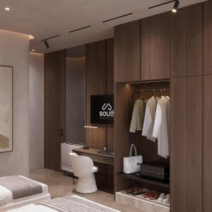 a bedroom with a closet with a bed and a desk at Boutique Hotel by Ruci in Terihat