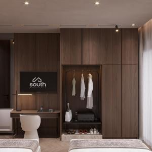 a bedroom with two beds and a wall with a closet at Boutique Hotel by Ruci in Terihat