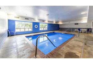 a large swimming pool in a large room at Studio 6 New Braunfels, Tx in New Braunfels