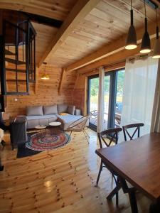 a living room with a couch and a table at Chalet Anika in Kolašin