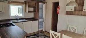 a kitchen with a sink and a counter top at Maisy's Retreat in Chapel Saint Leonards