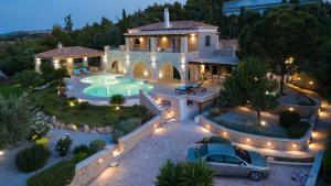an aerial view of a house with a swimming pool at Villa Athena Ermioni in Ermioni