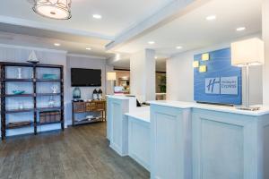 a salon with blue counters and a tv in a room at Holiday Inn Express Fairhope - Point Clear by IHG in Fairhope