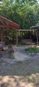 a park with benches and a swing at Domki u Ani in Białka