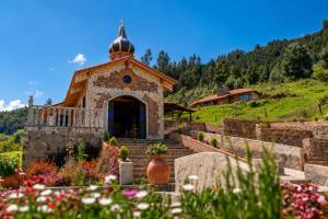 a church with a dome on top of a hill at Villa Germana in Paipa