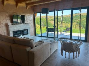 a living room with a couch and a fireplace at Stress Away in Zlatibor