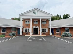 a brick building with the word gut on top of it at Governor House Inn Arlington/Falls Church in Falls Church