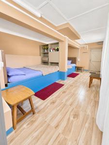 a room with two beds and a table at Holiday cabin in Sibey in Hāpoli