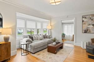 a living room with a couch and a table at Rochester Gem: 3BR Near All! in Rochester