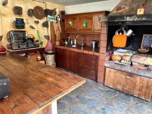 a kitchen with a wooden counter top in a room at Middle Earth in El Paso