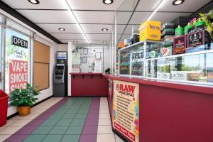 a fast food restaurant aisle with a counter and a pharmacy at OYO Oasis Motel Las Vegas I-15 in Las Vegas