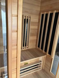 a sauna with wood paneling and a wooden closet at Antik Porta-Hangulatos parasztház kerttel,borospincével és infraszaunával in Szakony +33 photos