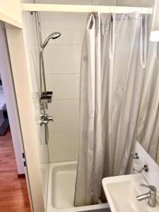 a bathroom with a shower and a sink at 2 Room Center Zurich Flats with Balcony - HildaB in Zurich